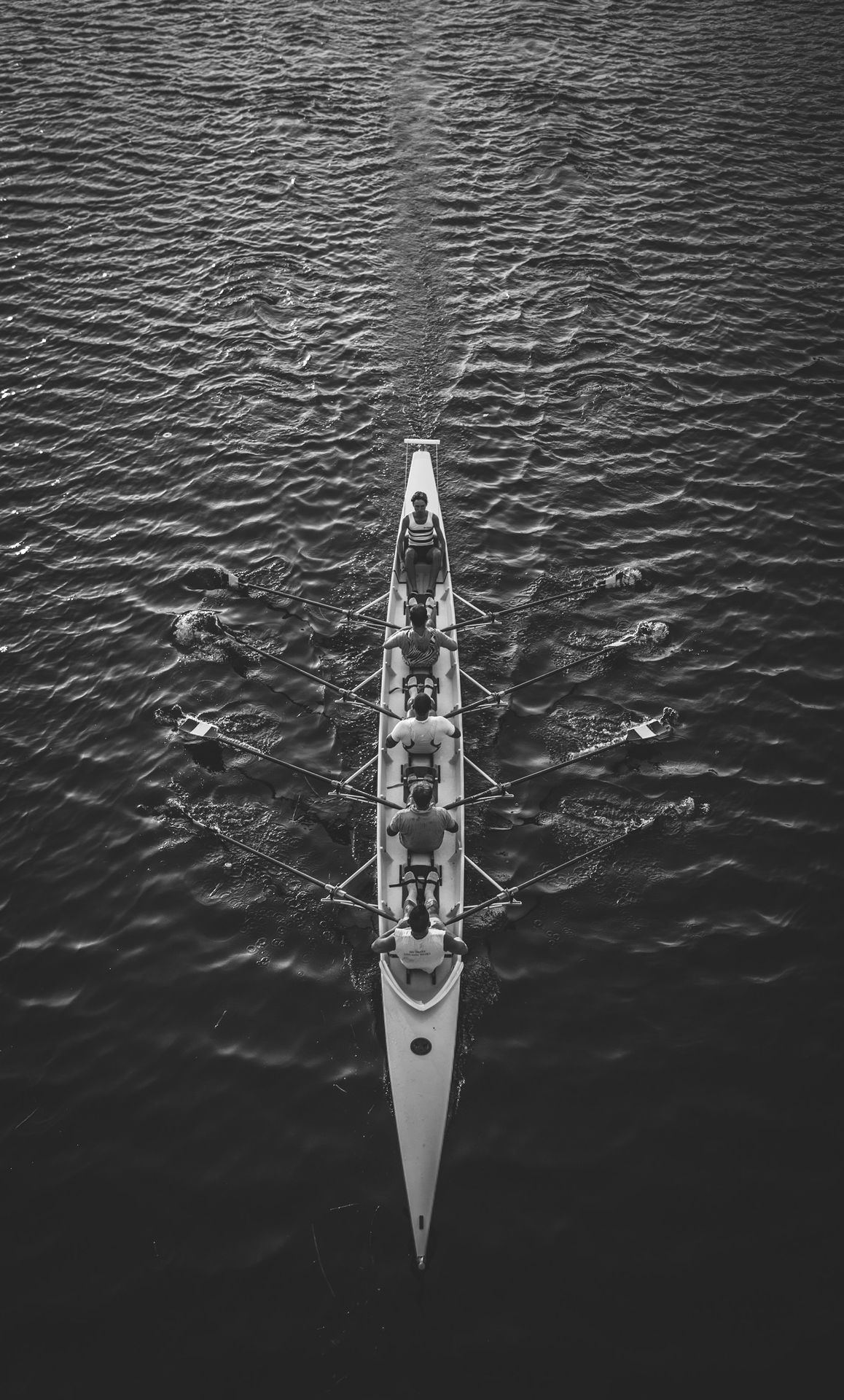 people riding boat on body of water